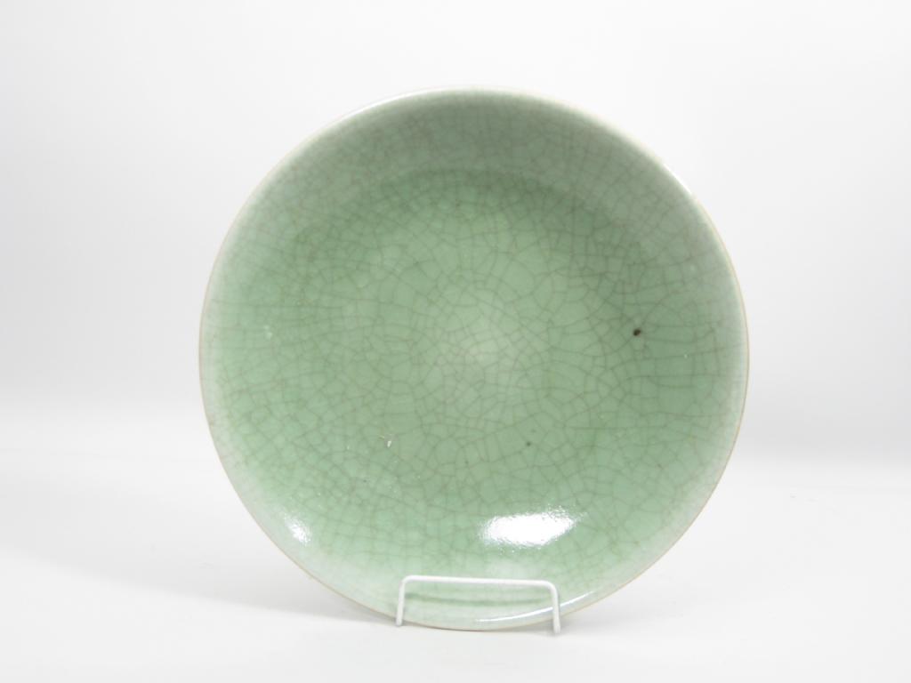 Appraisal: A Chinese crackle ware shallow Dish with celadon glaze in