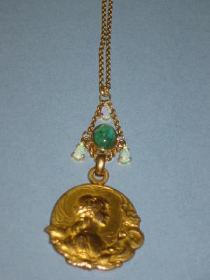 Appraisal: AN EMERALD AND OPAL ART NOUVEAU PENDANT the circular gold