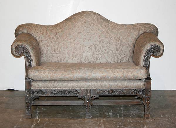 Appraisal: A George III style camel back upholstered sofa