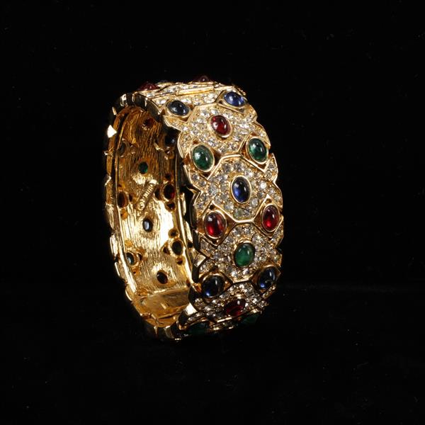 Appraisal: Ciner gold tone and pave hinged bangle bracelet with jewel