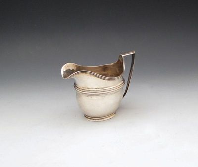 Appraisal: A Britannia standard silver cream jug probably by Carrington and