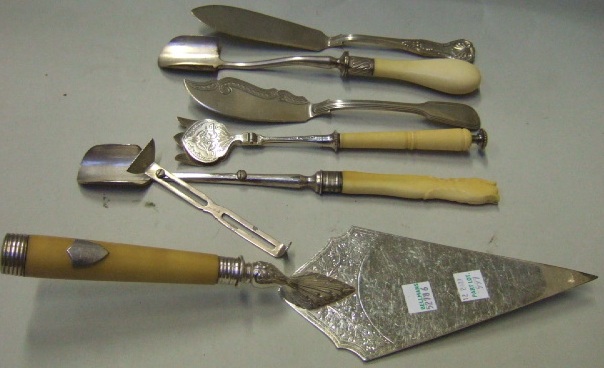 Appraisal: Plated wares comprising two butter knives a foundation stone laying