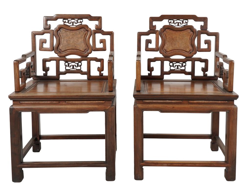 Appraisal: PAIR OF CHINESE CARVED HARDWOOD ARMCHAIRSCondition sun fading loose joints