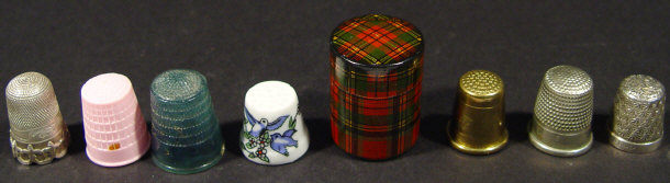 Appraisal: Cylindrical Prince Charlie tartanware thimble case and a selection of