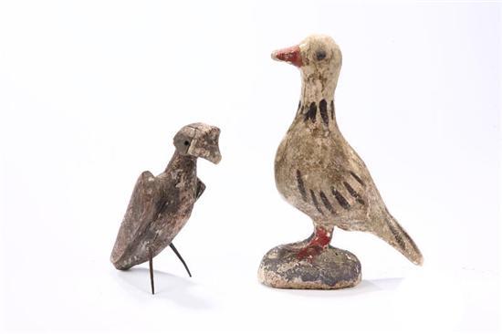 Appraisal: TWO FOLK ART BIRDS American late th century Carved wood