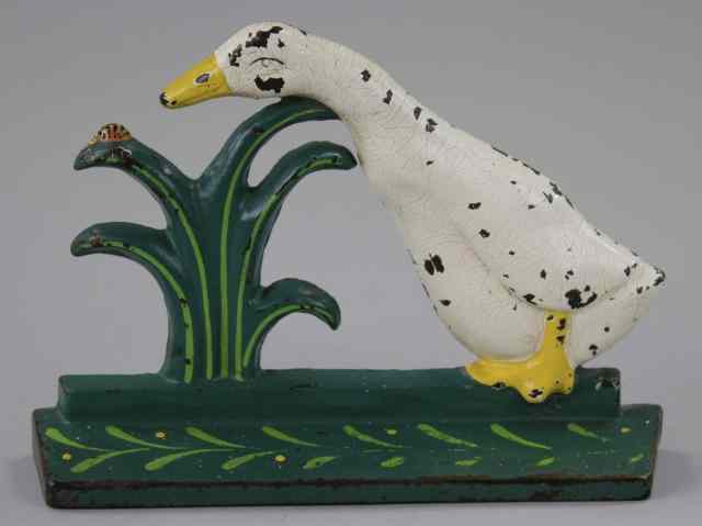 Appraisal: DUCK PECKING LADYBUG DOORSTOP Cast iron Littco Products charming piece