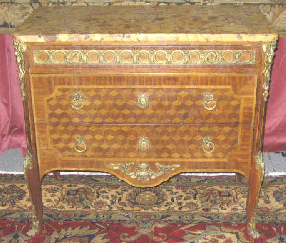 Appraisal: CONTINENTAL TH CENTURY PARQUETRY COMMODE Rectangular beige marble top over