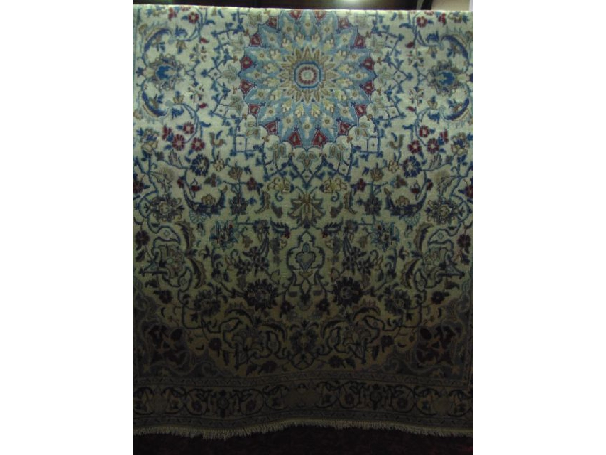 Appraisal: A Persian style wool rug the central circular medallion in