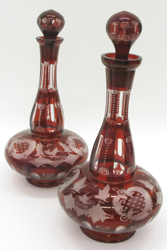 Appraisal: TWO BOHEMIAN RUBY-RED AND CLEAR GLASS DECANTERS cut and engraved