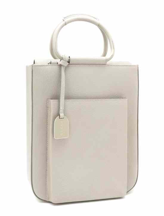 Appraisal: A Gucci Bone Leather Bag with metal handles and accompanying