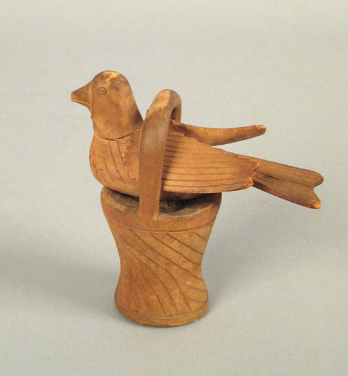 Appraisal: Southeastern Pennsylvania carved figure of a bird in a basket