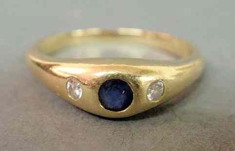 Appraisal: Diamond and sapphire gypsy ring k yg marked MBM containing