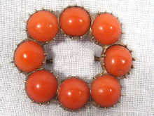 Appraisal: An antique yellow metal tests gold coral brooch cm x