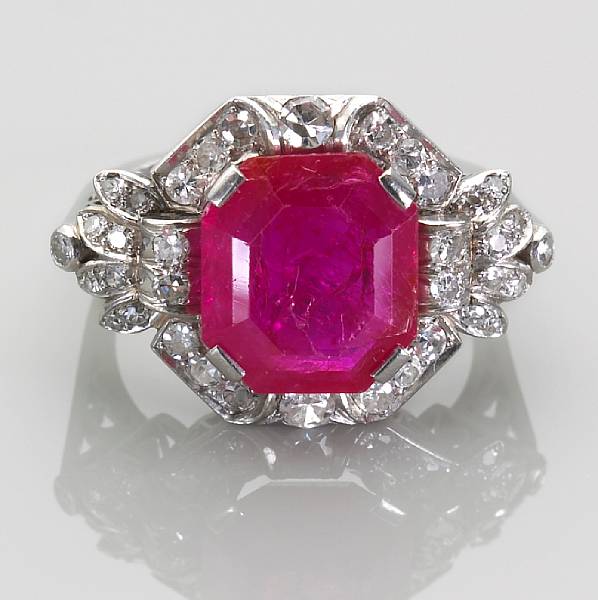 Appraisal: A ruby and diamond ring emerald-cut ruby weighing an estimated