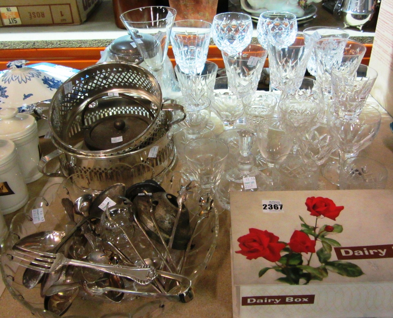 Appraisal: A quantity of silver plate flatware and tongs a glass