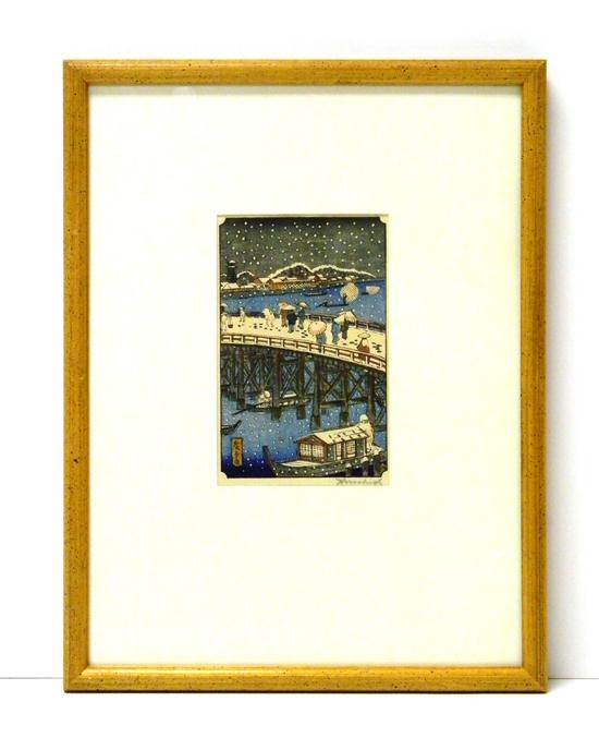 Appraisal: Japanese woodblock print snowy scene of pedestrians crossing bridge boat