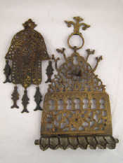 Appraisal: Judaica A cast brass chanukia and a hamsa with fishes