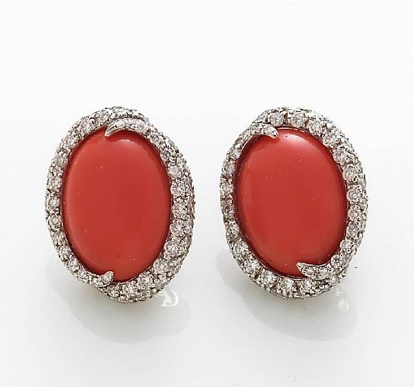 Appraisal: A pair of coral and diamond earrings mounted in eighteen