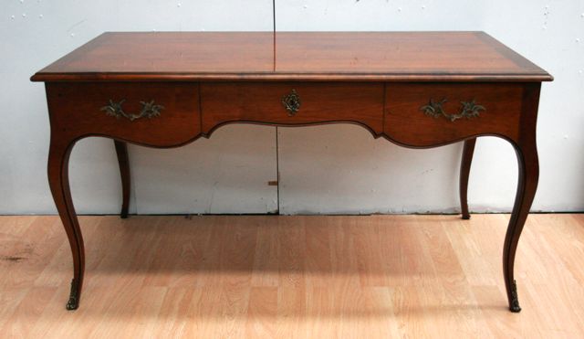 Appraisal: A French Louis XV style fruitwood desk th century cms