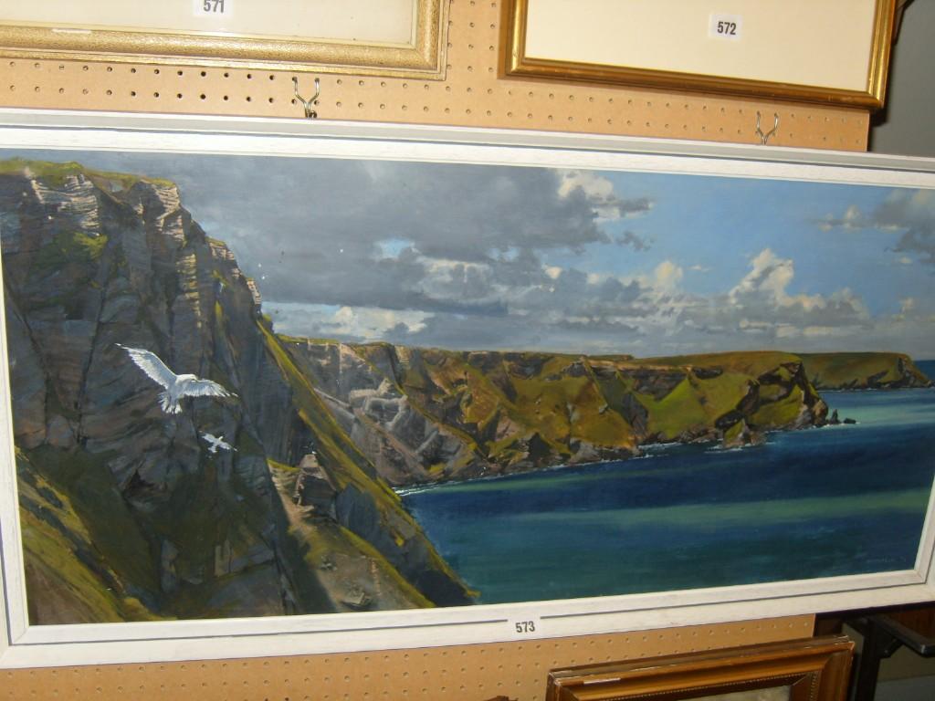 Appraisal: An oil painting on board showing an extensive coastal landscape