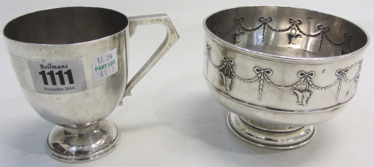 Appraisal: Silver comprising a christening mug with an angular handle Sheffield