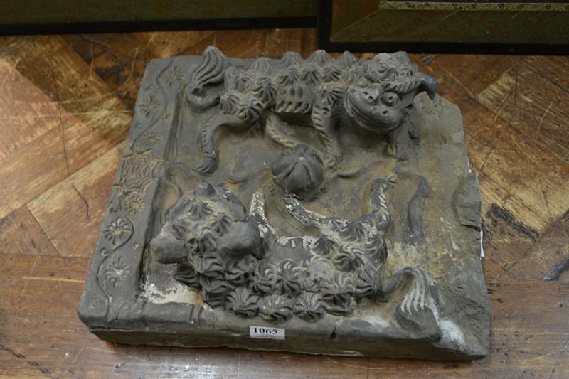 Appraisal: A HAN DYNASTY GREY CLAY BRICK MODELLED WITH TWO DOGS