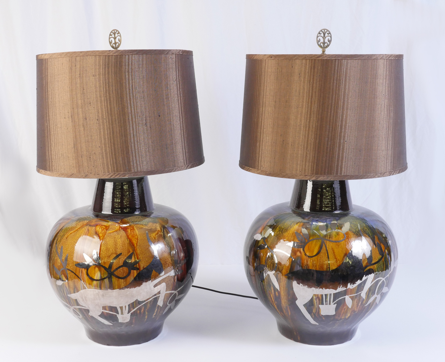 Appraisal: PAIR OF MID-CENTURY SILVER OVERLAY POTTERY LAMPS Mottled glaze with