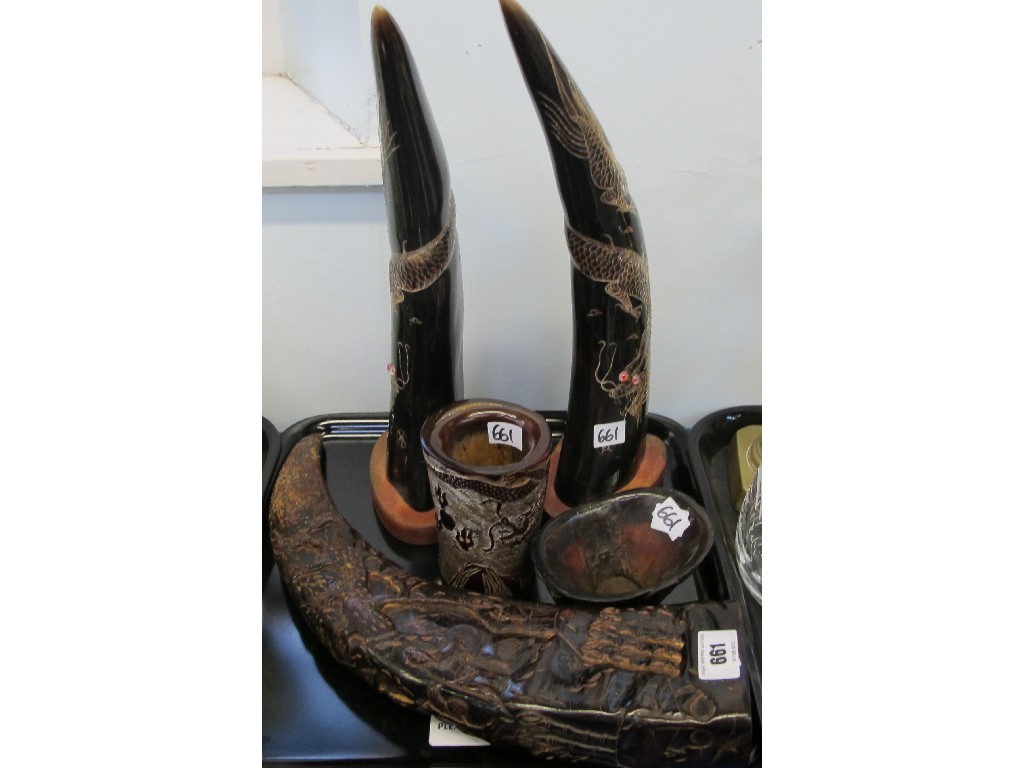 Appraisal: Pair of dragon decorated horns on stands and a carved