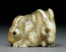 Appraisal: ANTIQUE IVORY NETSUKE Realistically carved antique ivory netsuke of a