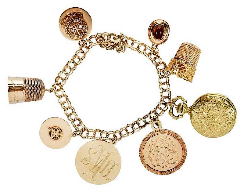 Appraisal: Gold Charm Bracelet eight charms including thimbles hospital pins and