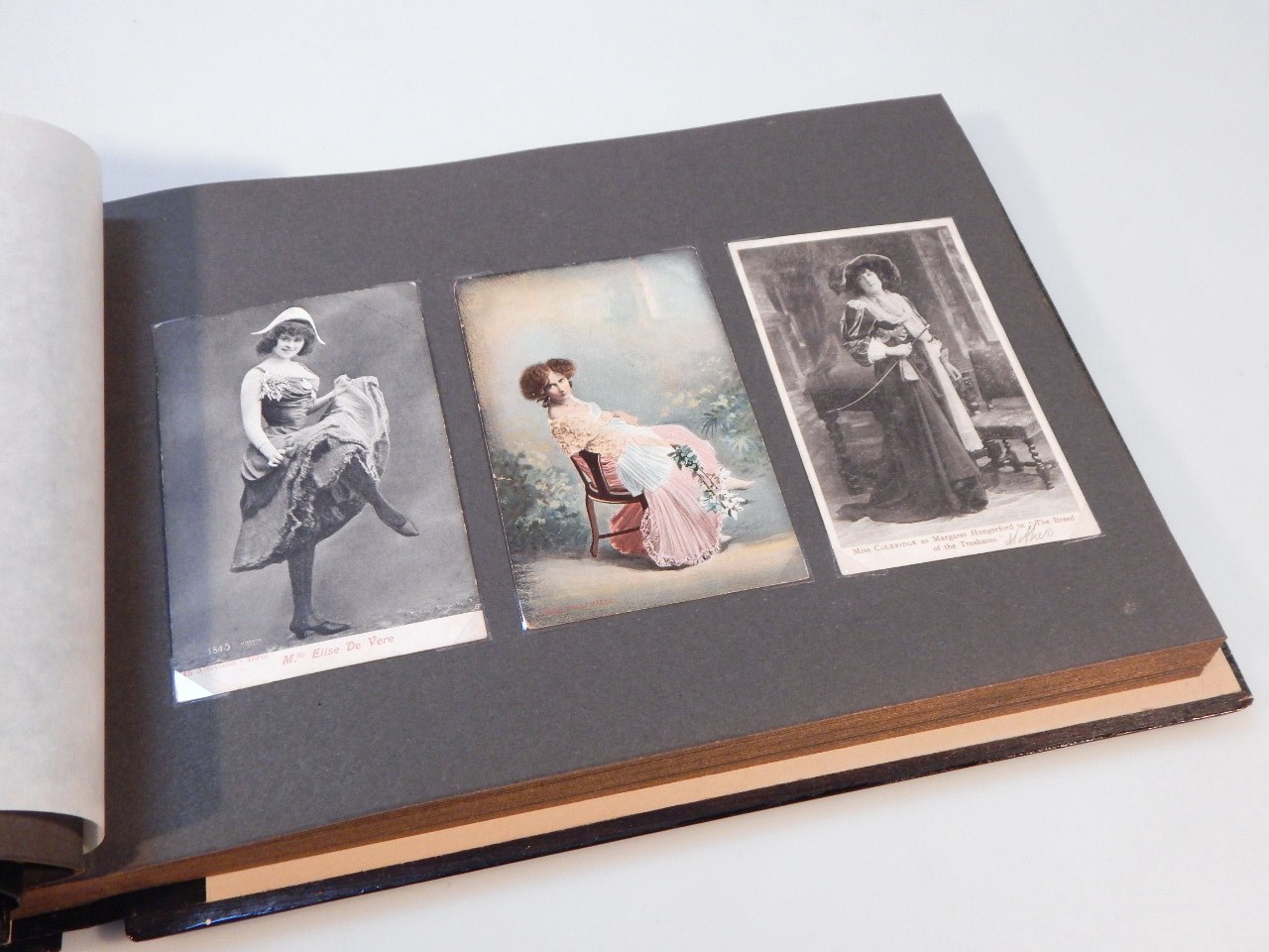 Appraisal: A Japanese style lacquered photograph album containing various postcards early