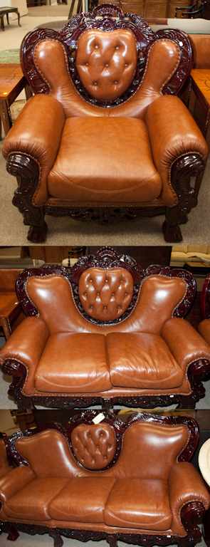 Appraisal: Rococo style carved wood faux leather upholstered three-cushion sofa Estimate