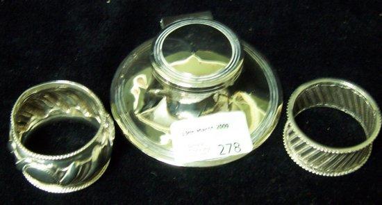 Appraisal: A circular ink pot with hinged cover and thread border