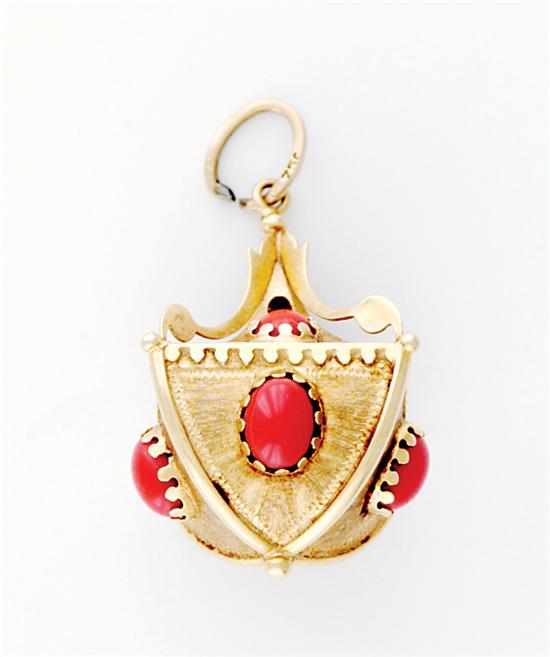 Appraisal: Gold and coral pendant circa engraved basket each panel set