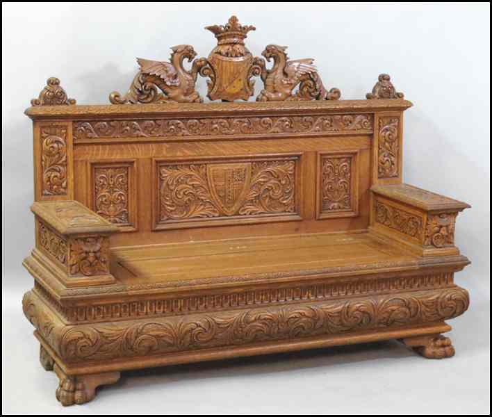 Appraisal: CONTINENTAL CARVED OAK HALL BENCH With a lift top seat