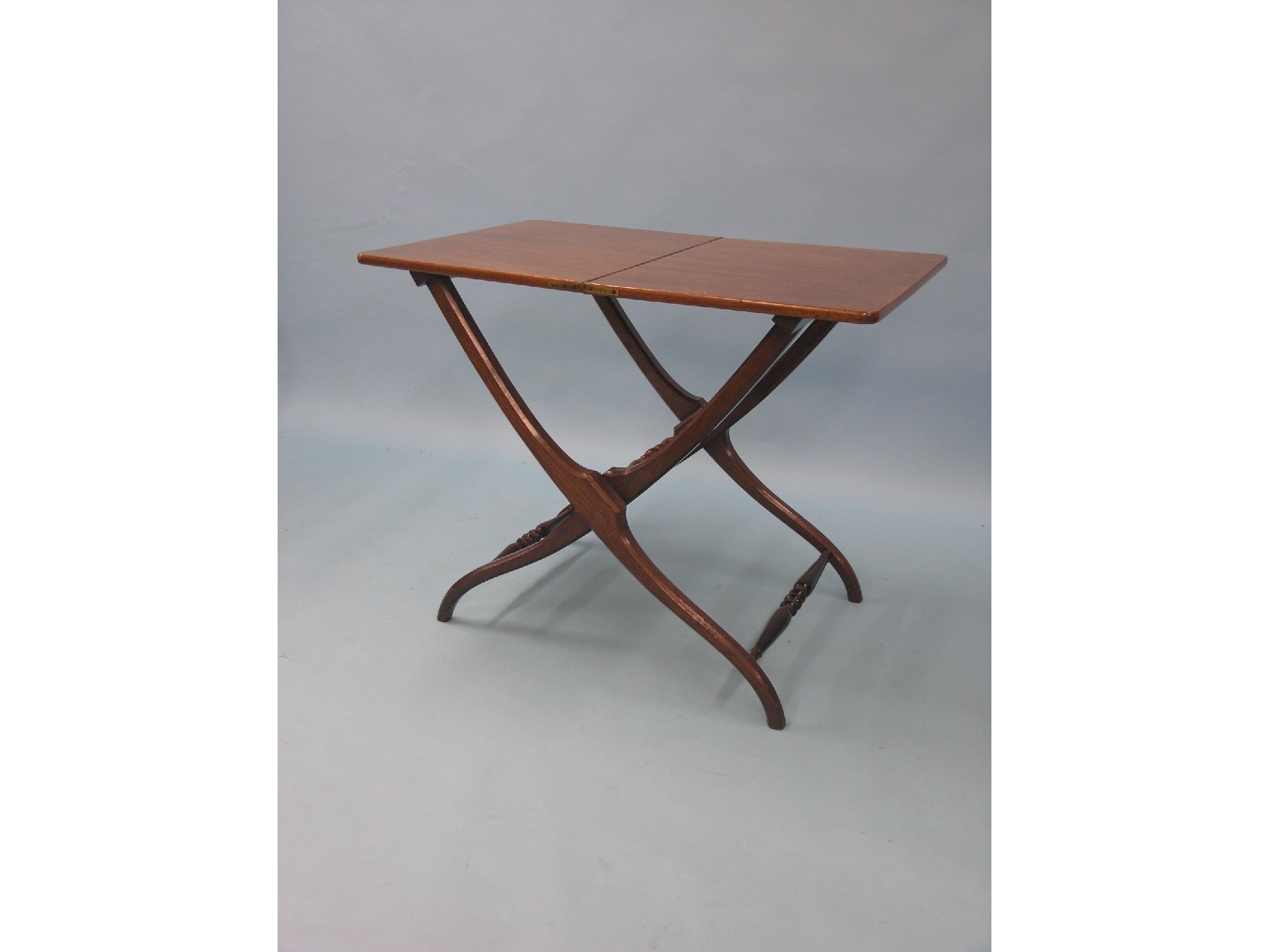 Appraisal: A Victorian mahogany patent-action folding table turned underframe with Horne