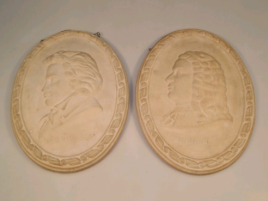 Appraisal: A plaster oval plaque moulded with a profile bust of