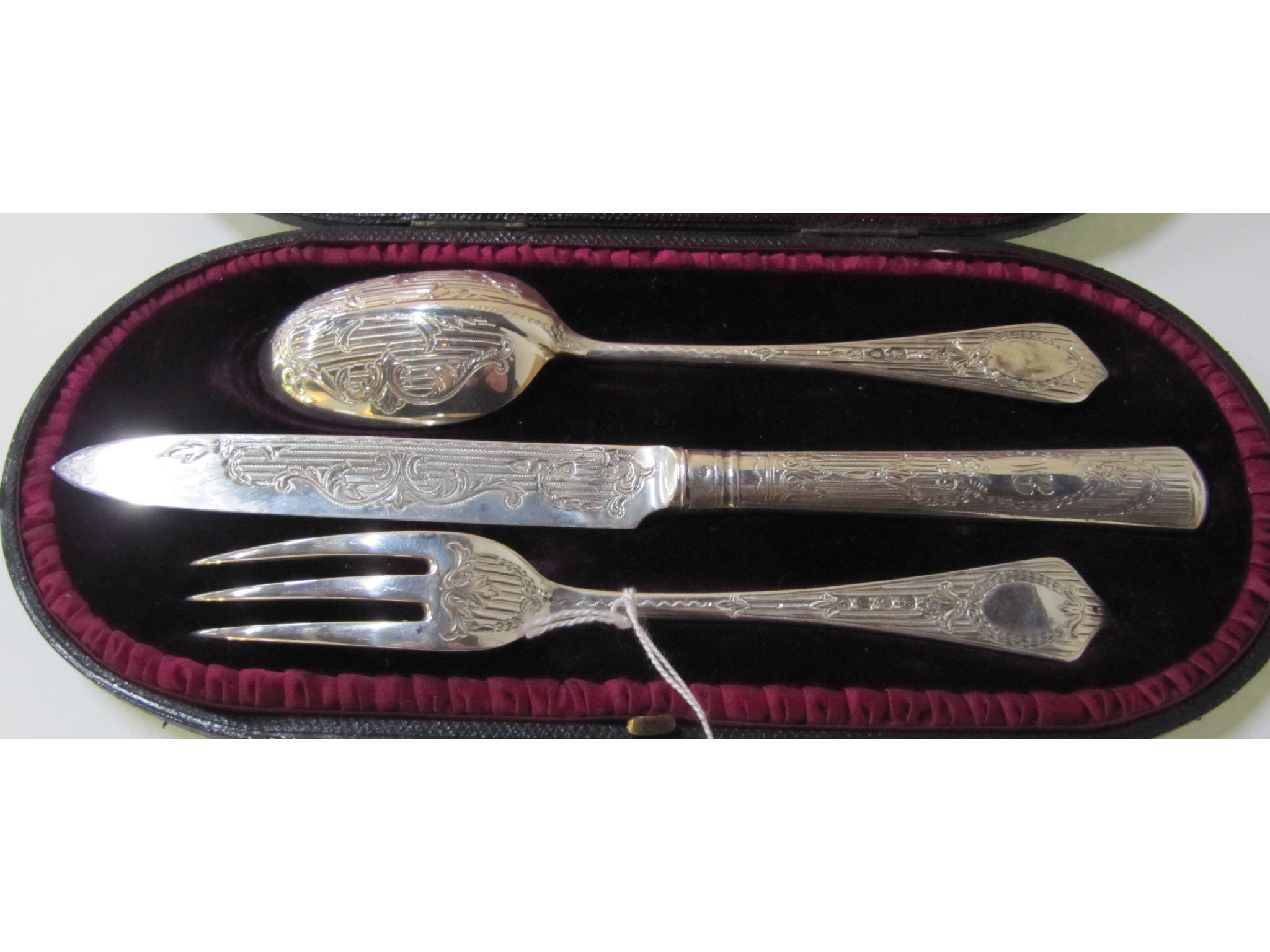 Appraisal: A cased three piece silver christening set London