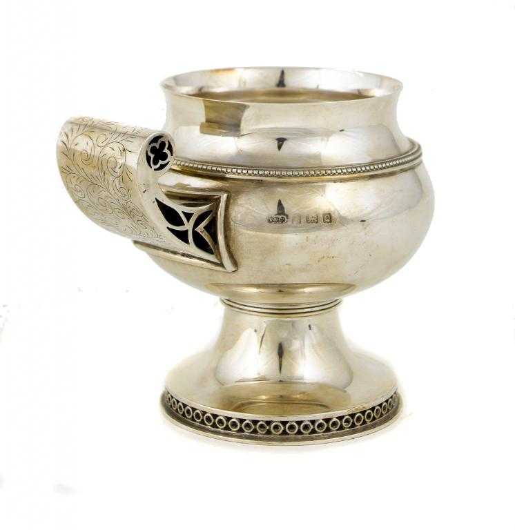 Appraisal: A GEORGE VI REPLICA MAZER CUP with upscrolled foliate engraved