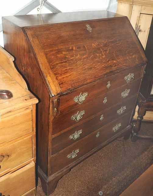 Appraisal: A TH CENTURY OAK BUREAU the fall front enclosing a