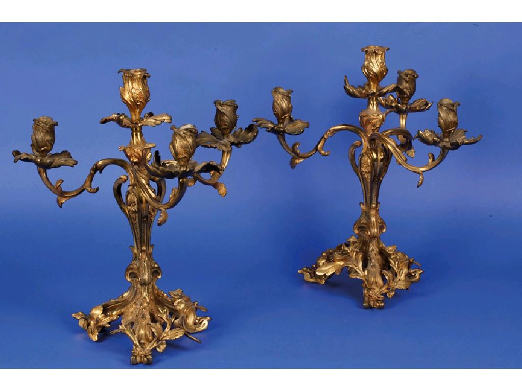 Appraisal: A PAIR OF GILT METAL THREE BRANCH CANDELABRA each with