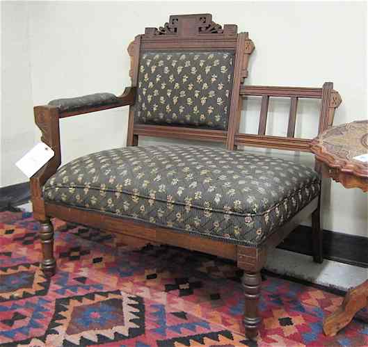 Appraisal: VICTORIAN LADY'S SINGLE-ARM SETTEE Eastlake design American c walnut with