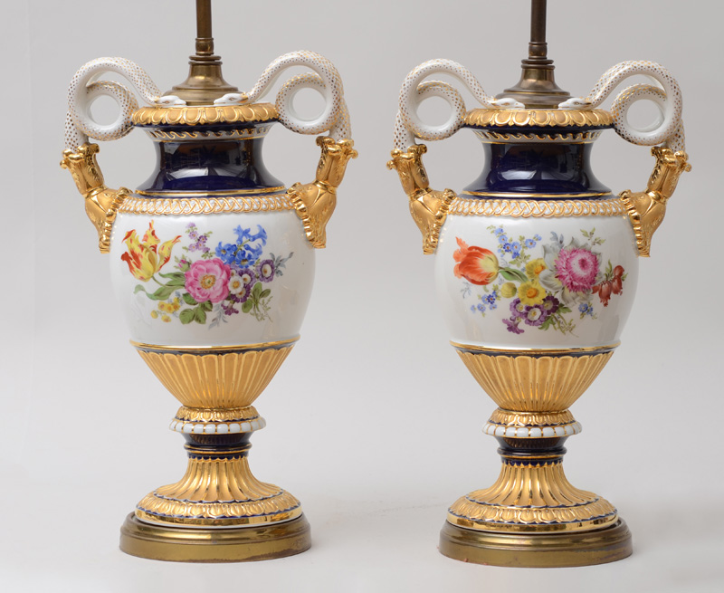 Appraisal: PAIR OF PORCELAIN URNS MOUNTED AS LAMPS Probably Meissen each