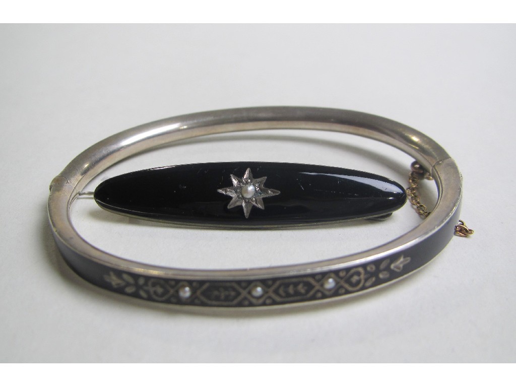 Appraisal: White metal and black enamel bangle set with seed pearls