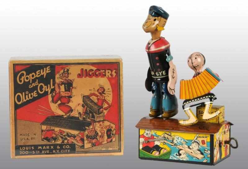 Appraisal: Tin Marx Popeye Olive Oyl Jiggers Wind-Up Toy Description American