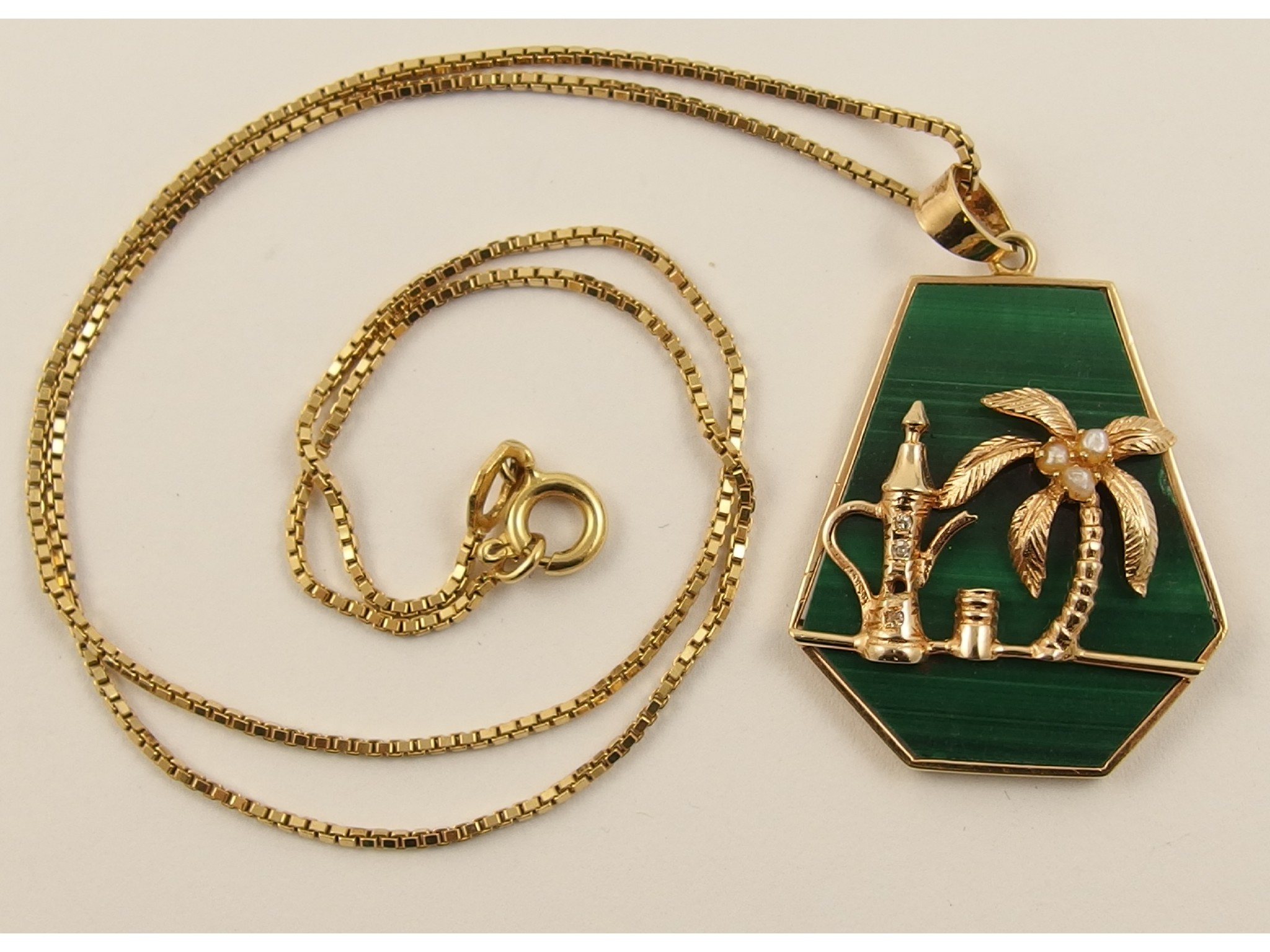 Appraisal: An ct malachite pendant decorated with palm tree and Arabic