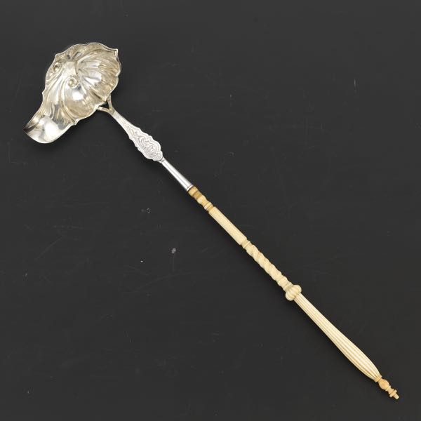 Appraisal: CONTINENTAL PUNCH LADLE CA - long A speciality item designed