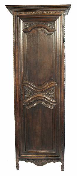 Appraisal: A Louis XV style carved oak bonnetiere height ft in