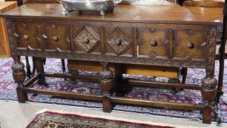 Appraisal: Spanish Revival style carved quartersawn oak sideboard having a rectangular