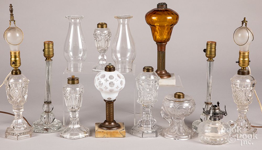 Appraisal: Eleven glass fluid and table lamps Eleven glass fluid and